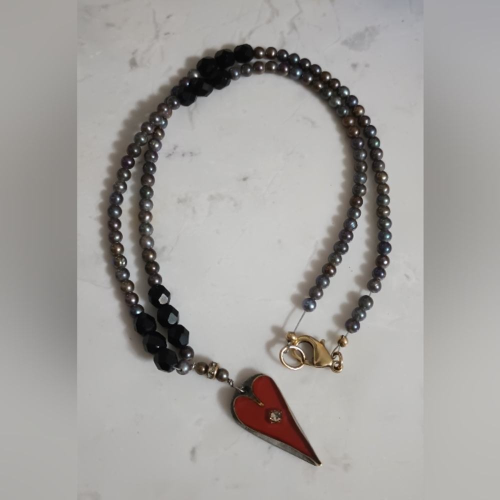 Pearls and 14 k yellow gold necklace.